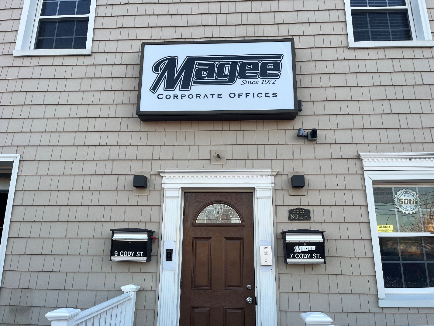 The main office of Magee Companies with one of their work pickup trucks in front of the office
